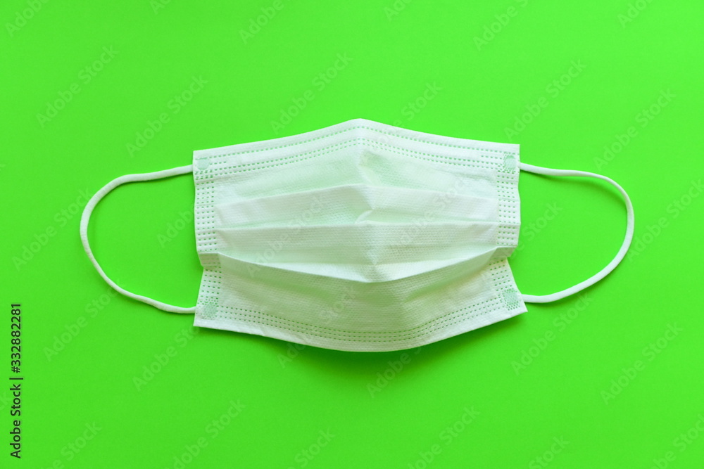 medical hygiene face mask on green background medical hygiene face mask on green background