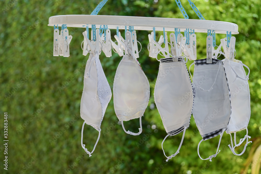 washing clean fabric mask hanging dry disinfect for wearing reuse Stock