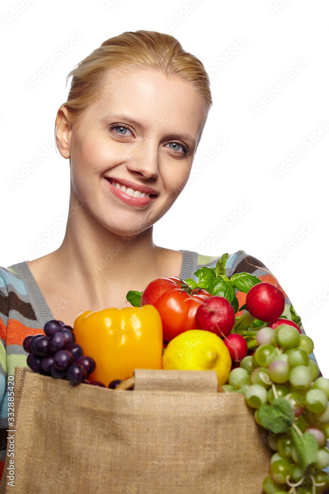 woman holding grocery paper shopping bag full of fresh vegetables. Diet healthy eating concept isolated on a white background woman holding grocery paper shopping bag full of fresh vegetables. Diet healthy eating concept isolated on a white background