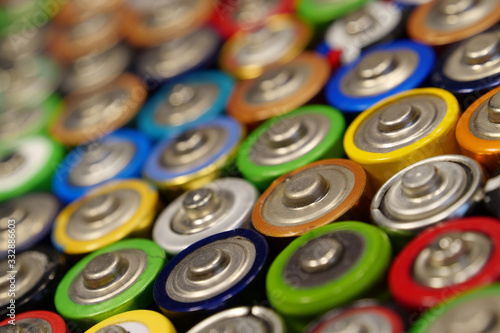 Many multicolored used batteries