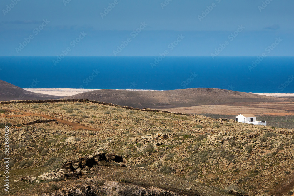 View across open landscape towards the coast at Villa Verde Corralejo Fuerteventura Canary Islands Spain View across open landscape towards the coast at Villa Verde Corralejo Fuerteventura Canary Islands Spain