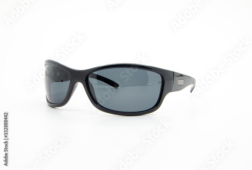Stylish sunglasses with black plastic frame isolated on white background. Studio shot.