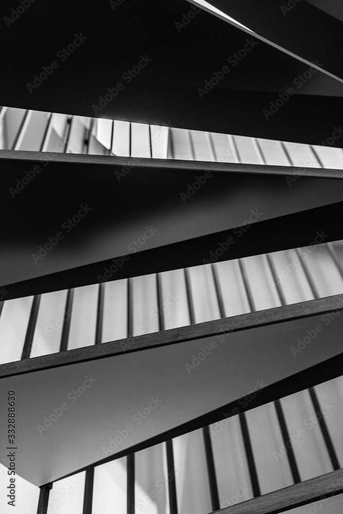 Wooden steps of a spiral staircase. Black and white photography. Wooden steps of a spiral staircase. Black and white photography.