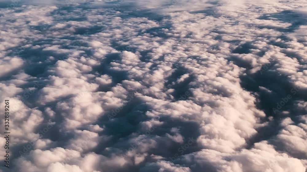 Epic cloudscape seen from plane at sunset Epic cloudscape seen from plane at sunset