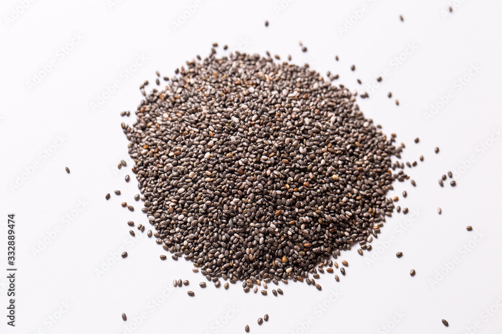 Chia seeds on a white isolated background close-up. Chia seeds on a white isolated background close-up.