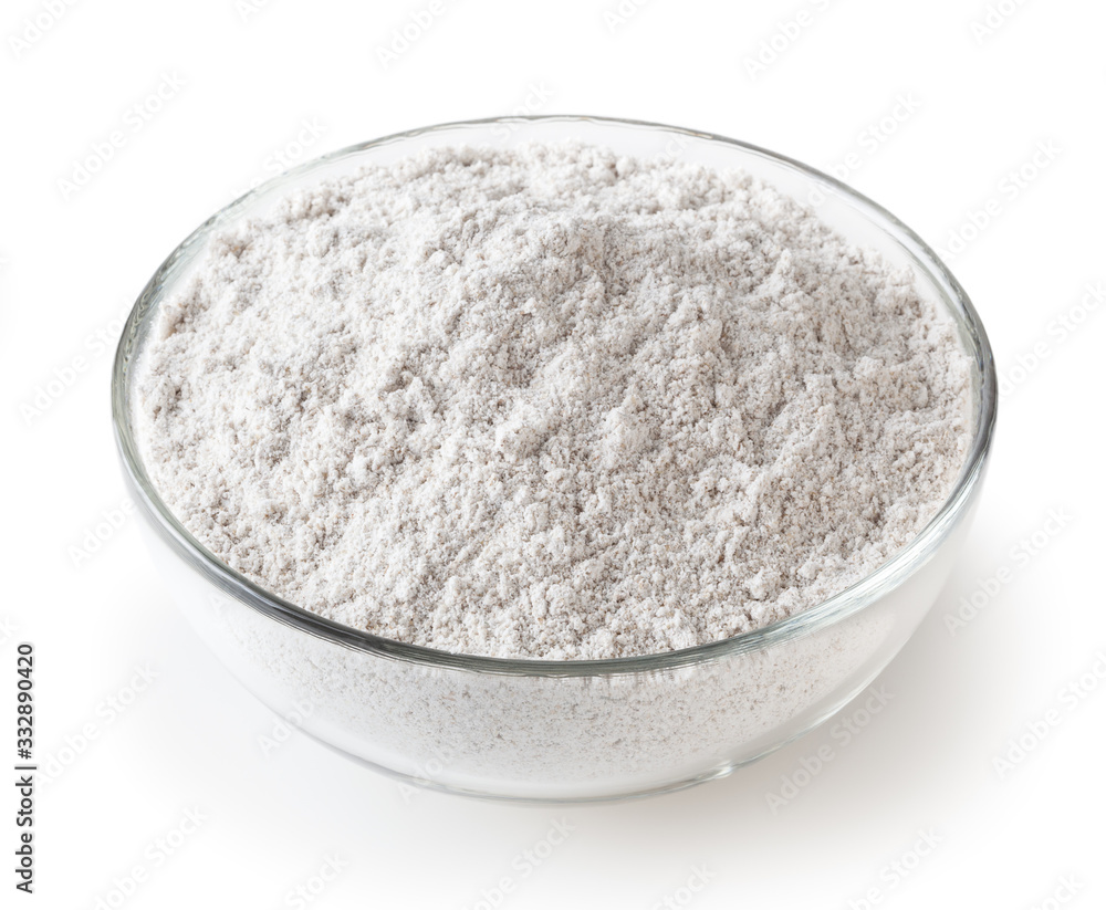 Rye flour in glass bowl isolated on white background with clipping path