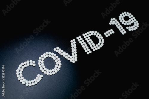 Covid-19 - Wuhan Novel Coronavirus made by many medicine pills isolated on black