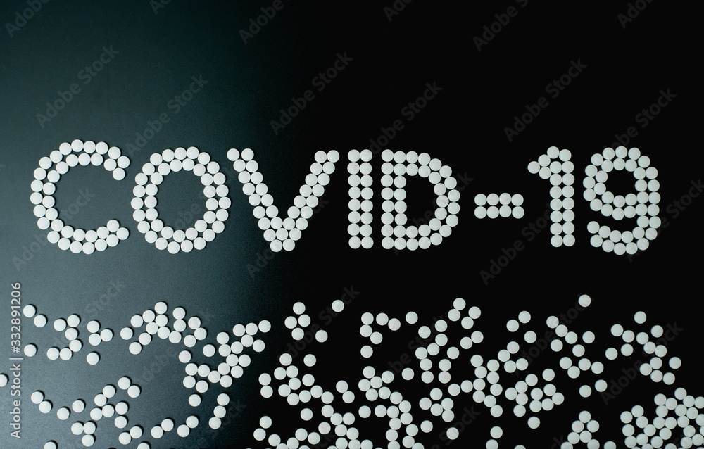 Covid-19 - Wuhan Novel Coronavirus made by many medicine pills isolated on black