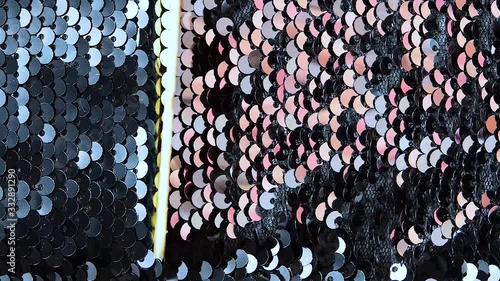 Metallic sequins, decoration changes its color when you hold it with a wooden stick, beautiful abstract background with flickering