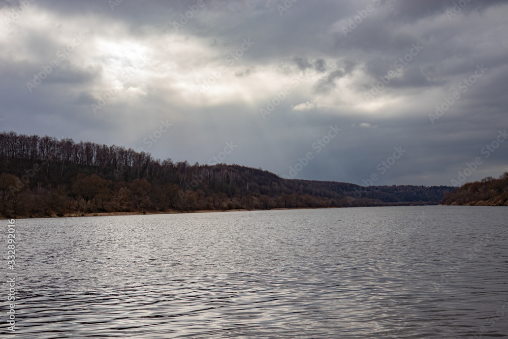 View of the Oka River in Russia in the spring in cloudy weather, beautiful river landscape. View of the Oka River in Russia in the spring in cloudy weather, beautiful river landscape.