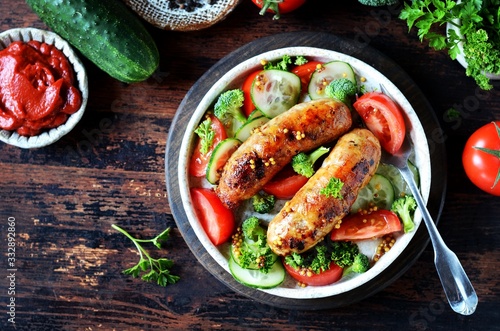 Homemade chicken (turkey) fried sausages with broccoli, tomato and cucumber salad 