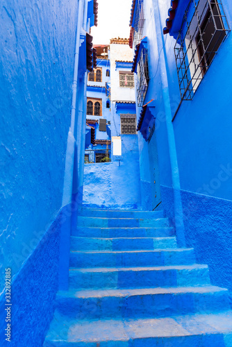 Narrow street in the blue city Chefchaouen, Morocco. Vertical. © ggfoto