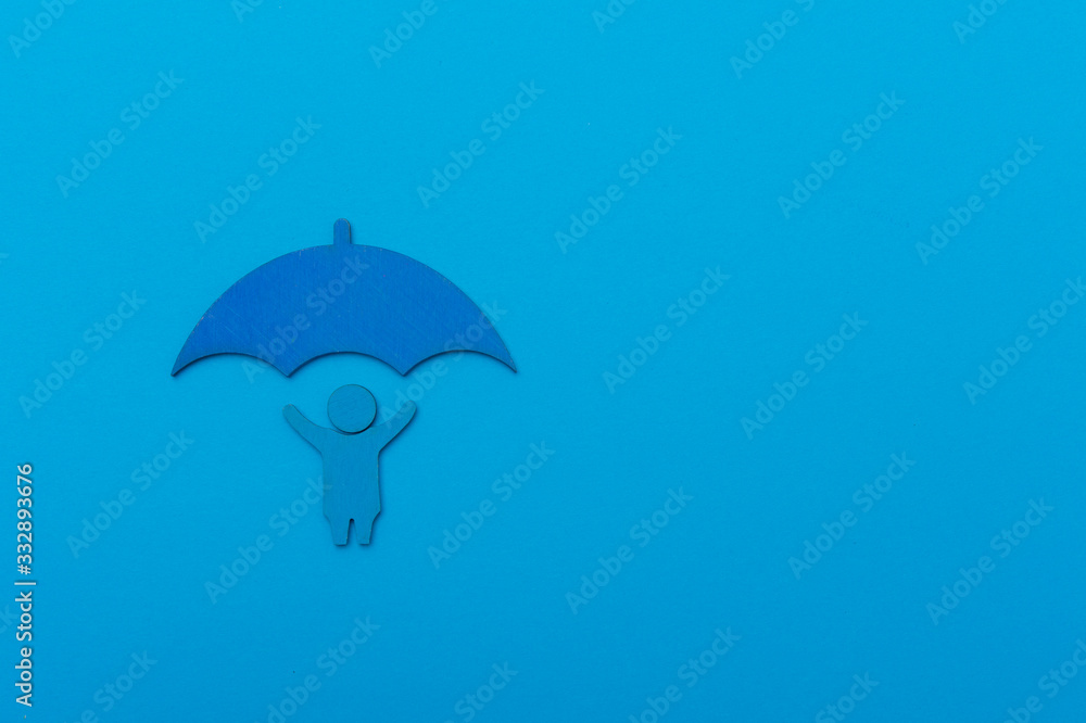 World Autism Awareness Day Concept. The child holds an umbrella on blue background World Autism Awareness Day Concept. The child holds an umbrella on blue background