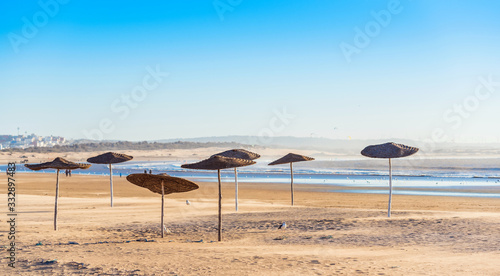 Fototapeta Naklejka Na Ścianę i Meble -  View of the sandy empty beach, Essaouira, Morocco. Copy space for text.