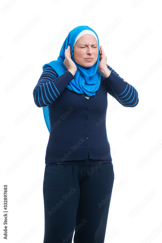 Angry arabic muslim woman covering ears with fingers Angry arabic muslim woman covering ears with fingers
