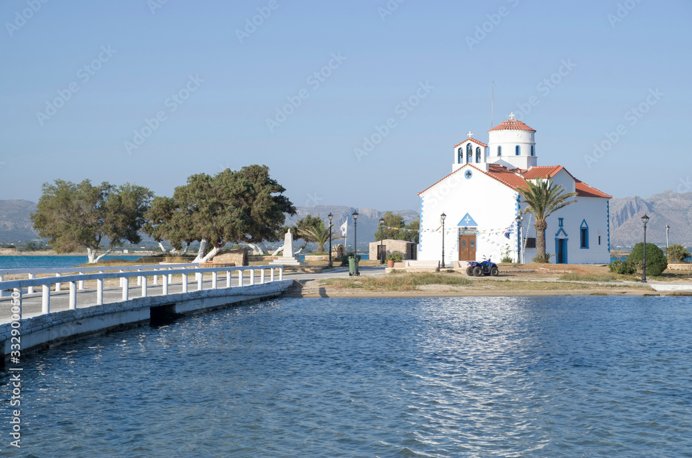Small white traditional church  close to Elafonisos Port in Greece