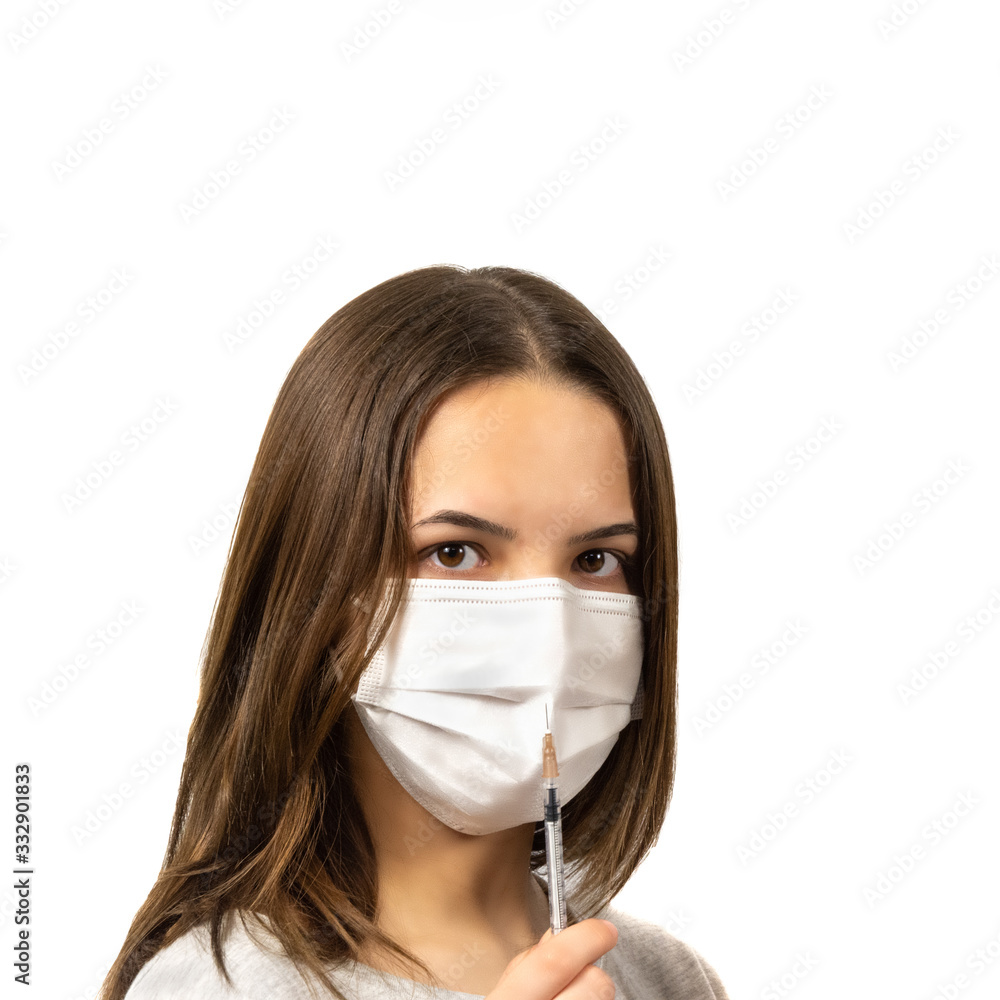 Girls in medical masks are protected from the epidemic of coronavirus isolated on a white background Girls in medical masks are protected from the epidemic of coronavirus isolated on a white background