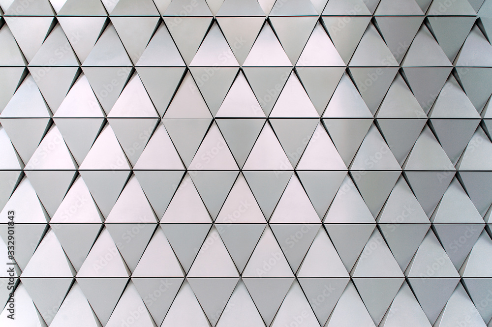 Building structures of aluminum triangle geometry on facade of modern ...