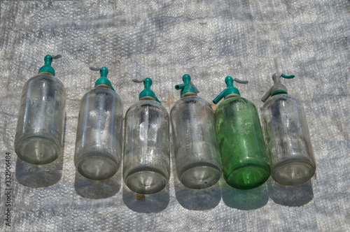 Konstfotografi set of transparent glass bottles at a street market in Spain
