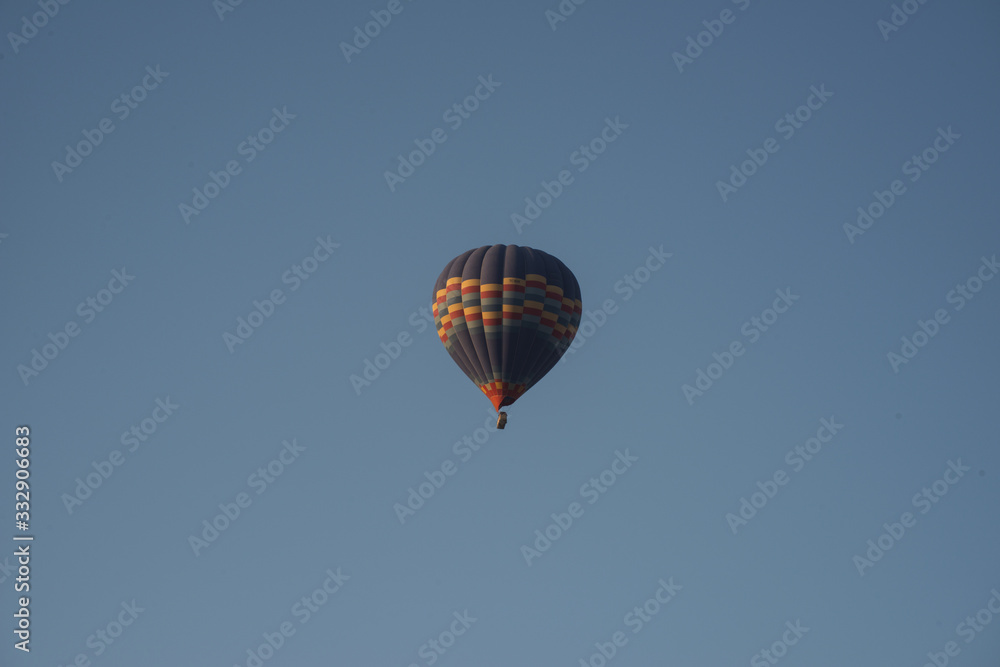 Naklejka premium The great tourist attraction of Cappadocia - balloon flight. Cappadocia is known around the world as one of the best places to fly with hot air balloons. Goreme, Cappadocia, Turkey.