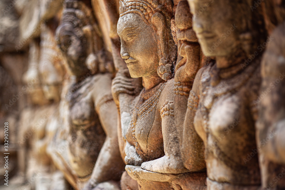 statues carved out of rock in Asian temples