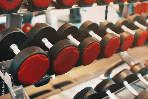 Photo of weights in a gym during day time, morning sport routine