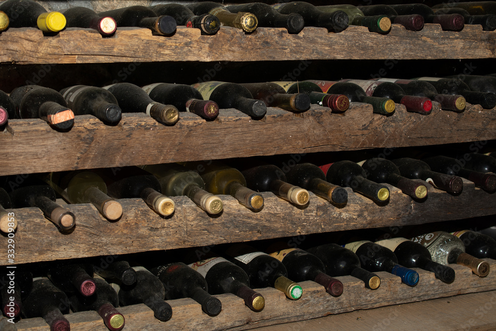 Old wine bottles in the wine cellar. The cellar is located in Montenegro in the region of Сrmnica.