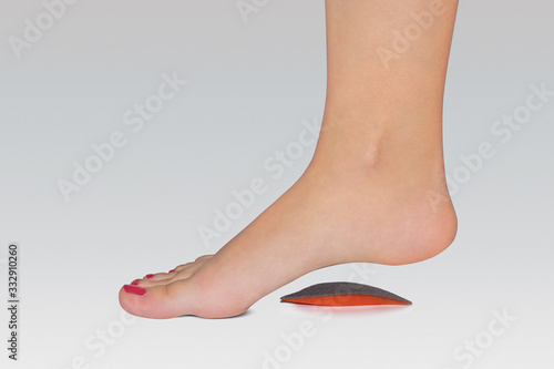 Orthopedic silicone heel from corns for the correction of different lengths of legs isolated on white background. Silicone insert for the forefoot. Silicone thumb protector with interdigital septum pr photo