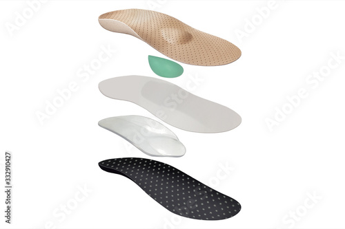 Isolated orthopedic insole on a white background. Treatment and prevention of flat feet and foot diseases. Foot care  comfort for the feet. Wear comfortable shoes. Medical insoles.