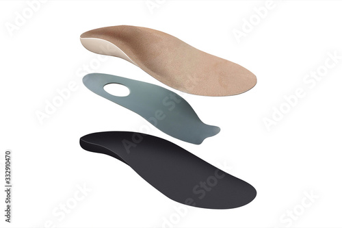 Isolated orthopedic insole on a white background. Treatment and prevention of flat feet and foot diseases. Foot care, comfort for the feet. Wear comfortable shoes. Medical insoles.