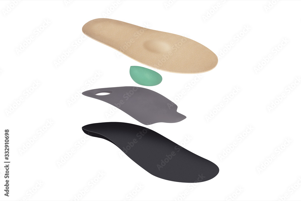 Isolated orthopedic insole on a white background. Treatment and prevention of flat feet and foot diseases. Foot care, comfort for the feet. Wear comfortable shoes. Medical insoles. Isolated orthopedic insole on a white background. Treatment and prevention of flat feet and foot diseases. Foot care, comfort for the feet. Wear comfortable shoes. Medical insoles.