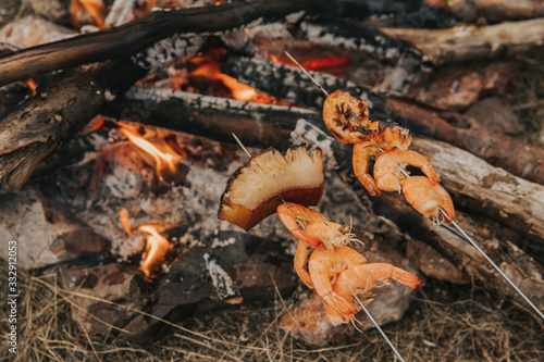 Preparing Shrimp at campfire.