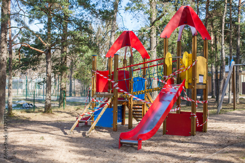 Closed, roped off children's playground amid COVID-19 Coronavirus pandemic in Europe © Evoque