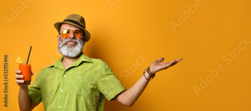 Photography Bearded grandpa in hat, green shirt, sunglasses