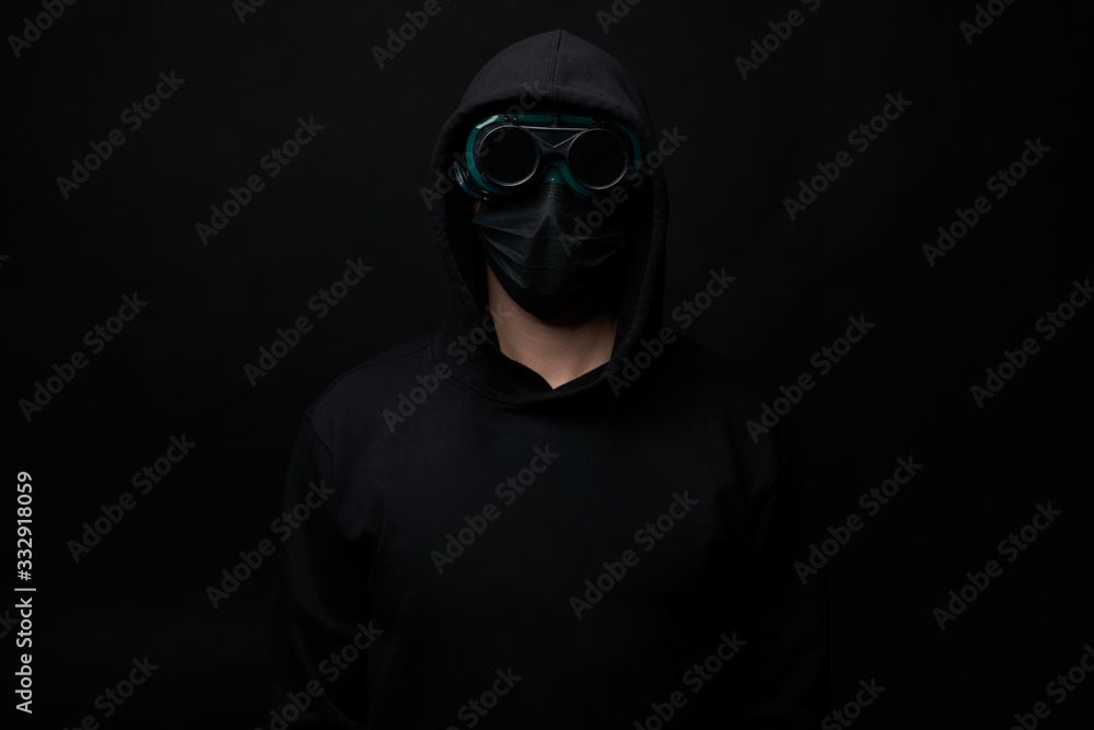 Young man wearing face mask and protective glasses.