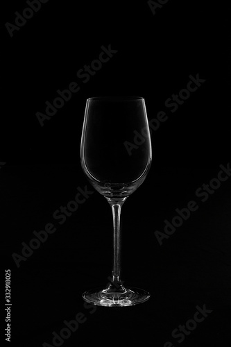 Empty transparent wine glass in ther black and white background