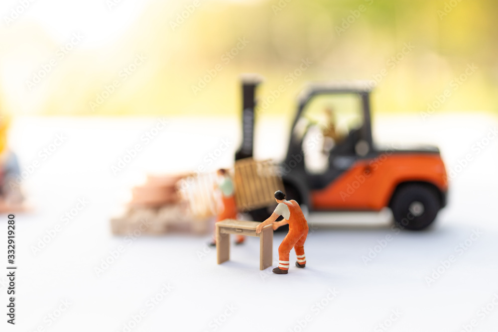 Miniature people : Worker move thing to destination place. Image use for logistic concept, shipment order from customer Miniature people : Worker move thing to destination place. Image use for logistic concept, shipment order from customer