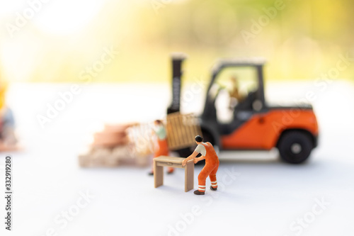 Miniature people   Worker move thing to destination place. Image use for logistic concept  shipment order from customer