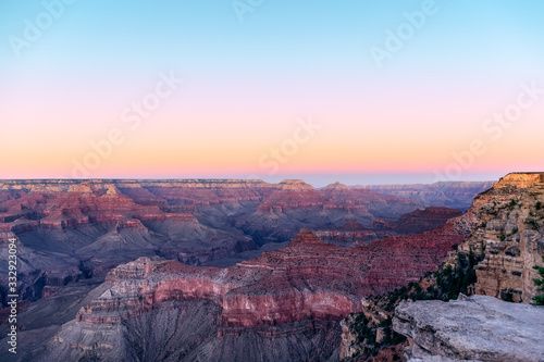 Beautiful view of the Grand Canyon painted by the rays of stunning pink sunset