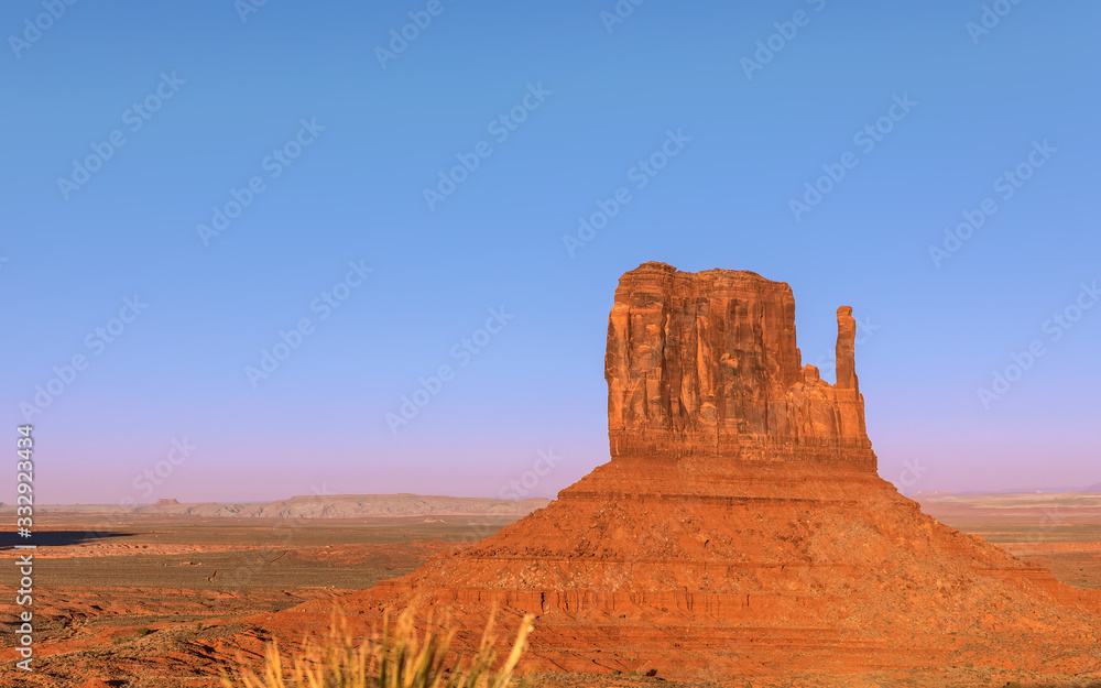 Beautiful sunset over famous Butte of Monument Valley on the border between Arizona and Utah, USA