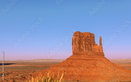 Beautiful sunset over famous Butte of Monument Valley on the border between Arizona and Utah, USA