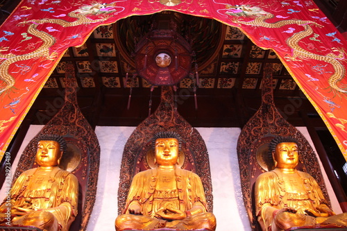  Golden Buddhas in the Great Hall of the Jade Buddha Temple in Shanghai photo