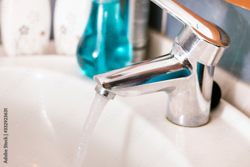 running water faucet in the bathroom running water faucet in the bathroom