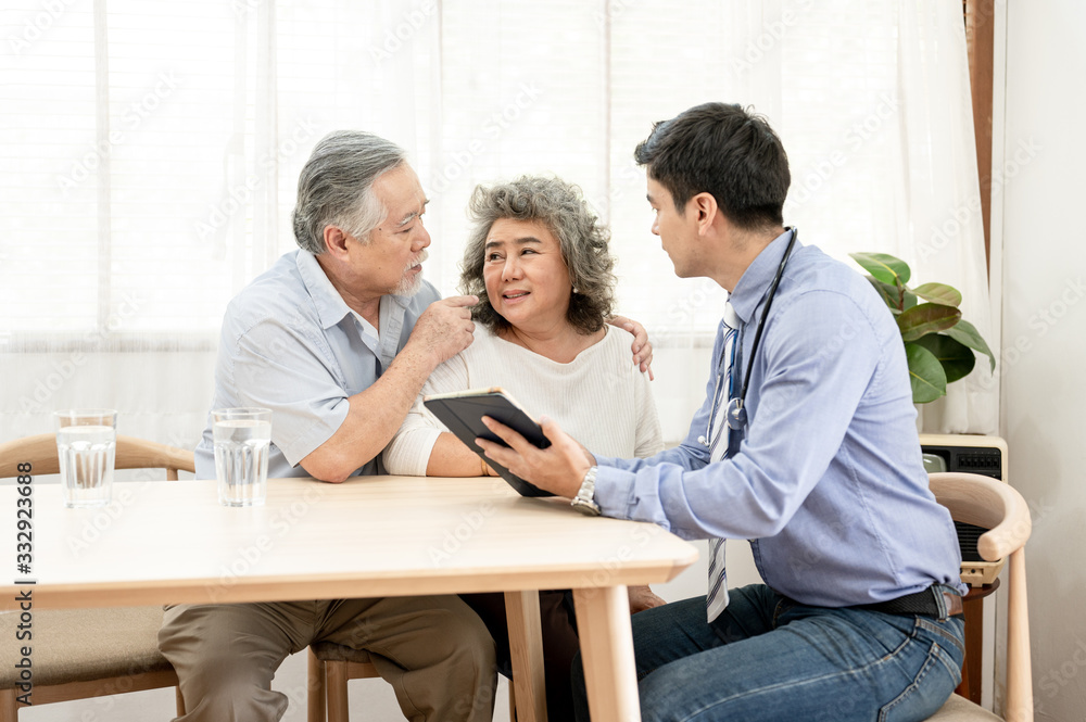 Asian elderly couples are sick doctor to check their symptoms at home. Health care , life style, pharmacy, medical, elder insurance after retire concept. Asian elderly couples are sick doctor to check their symptoms at home. Health care , life style, pharmacy, medical, elder insurance after retire concept.