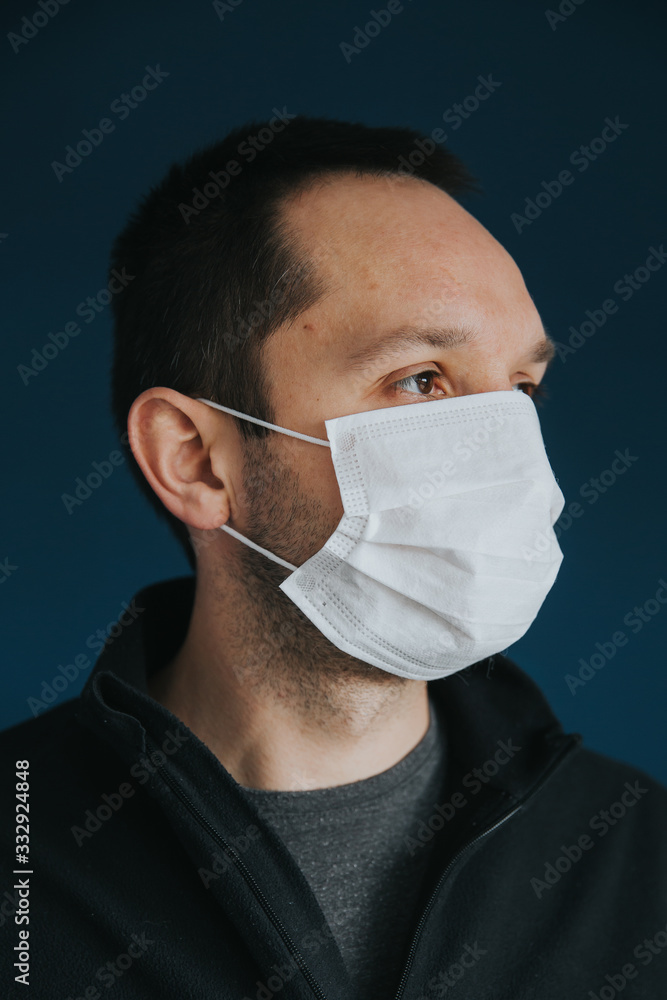 Worldwide alert of pandemic disease: Covid-19 concept. Man wearing protective mask during coronavirus alert. Worldwide alert of pandemic disease: Covid-19 concept. Man wearing protective mask during coronavirus alert.