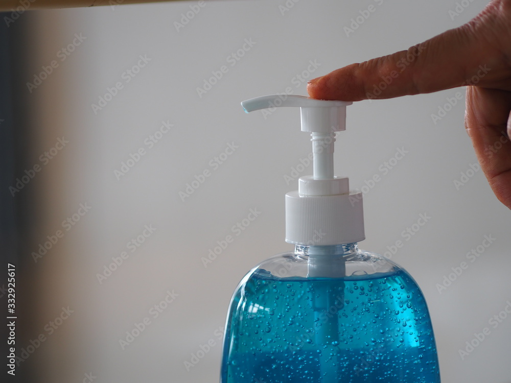 hand women push Sanitizer, gel alcoholic mixture with gelatin in clear Plastic bottle with pump pushing, washing clean dirty to prevent germs protect colona virus, covid 19 hand women push Sanitizer, gel alcoholic mixture with gelatin in clear Plastic bottle with pump pushing, washing clean dirty to prevent germs protect colona virus, covid 19