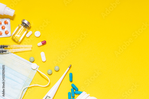 Creative flat lay overhead composition with medical supplements on white background with copy space for your text. Pandemic prevention concept.