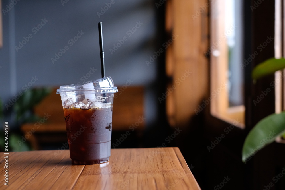 Ice Coffee Americano Plastic  On Wood Background  Cafe 