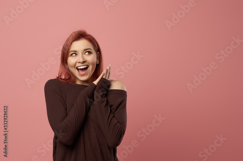 Happy woman with gray eyes in burgundy sweater