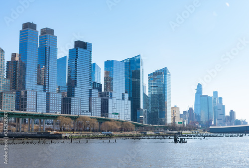 Modern Glass Skyscrapers in the Lincoln Square New York City Skyline along the Hudson River on a Clear Blue Day